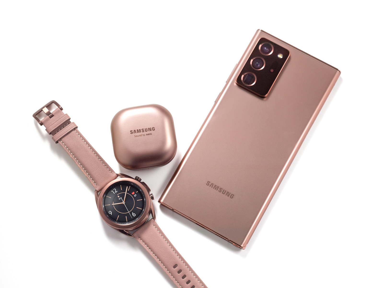 Galaxy Note20 Ultra, Galaxy Watch3 and Galaxy Buds Live in Mystic Bronze on white surface.