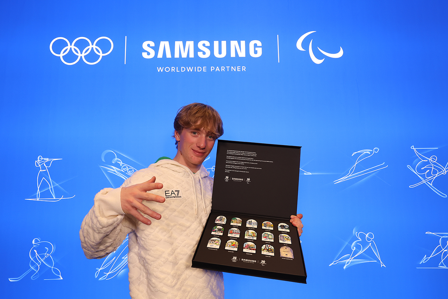 Team Samsung Galaxy athlete Miro Tabanelli holds a case of his limited-edition Samsung Milano Cortina 2026 pins during the Hwaiting Night event at Samsung House.