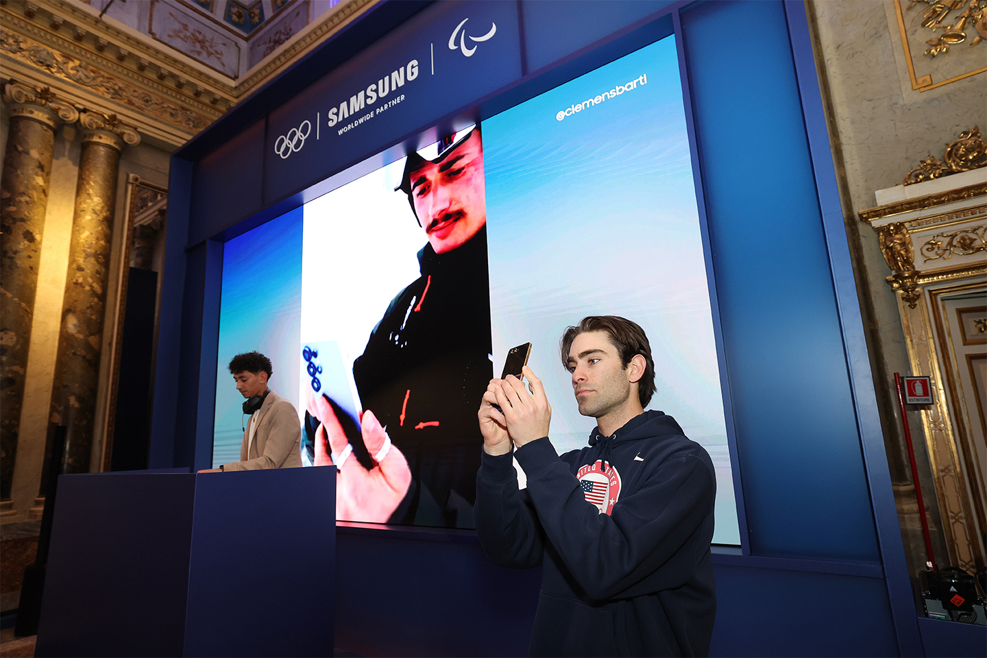 Team Samsung Galaxy athlete Alex Hall takes a photo with his Galaxy Z Flip7 Olympic Edition at Samsung House during the Hwaiting Night event.
