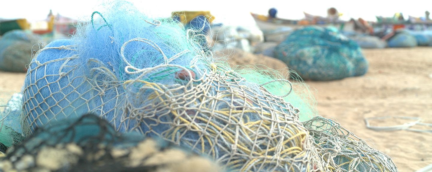 Discarded fishing nets on a gloomy beach