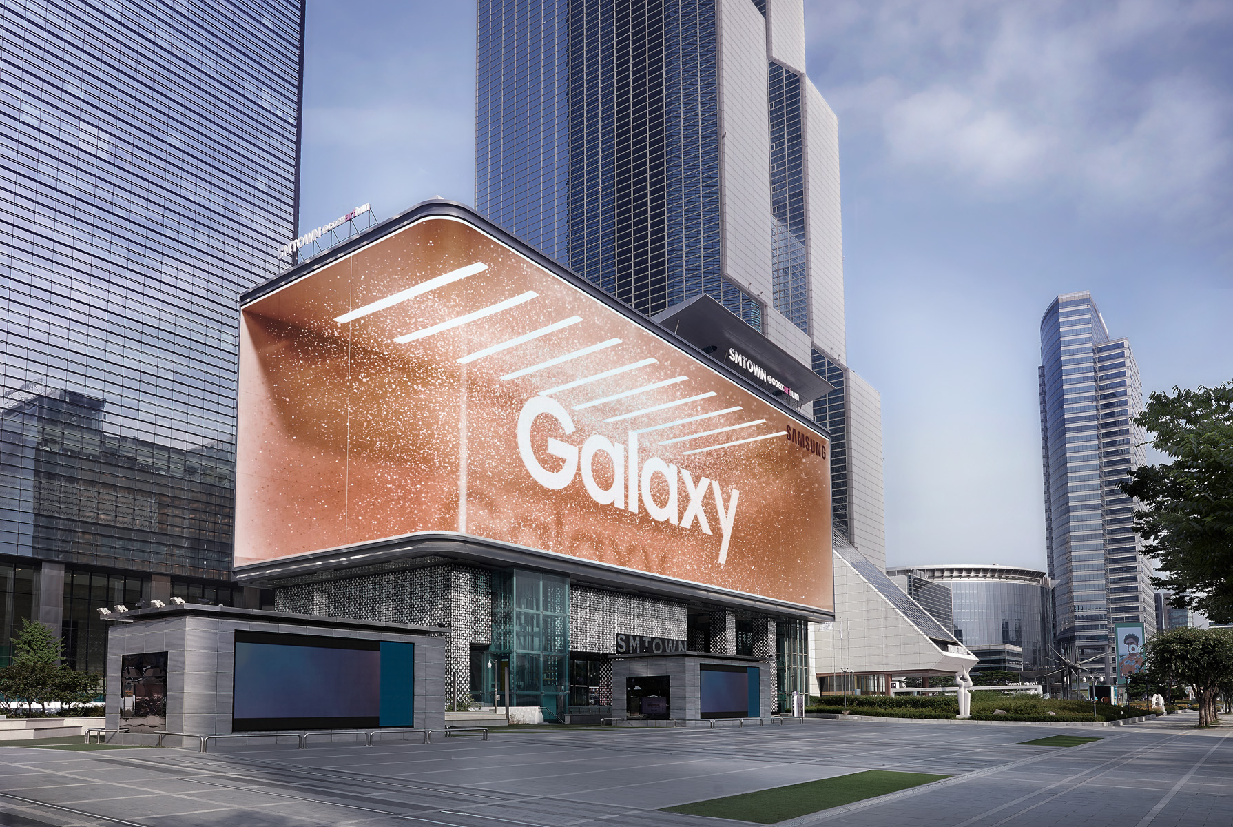 Large digital display with bronze backdrop and white letters spelling out the word Galaxy