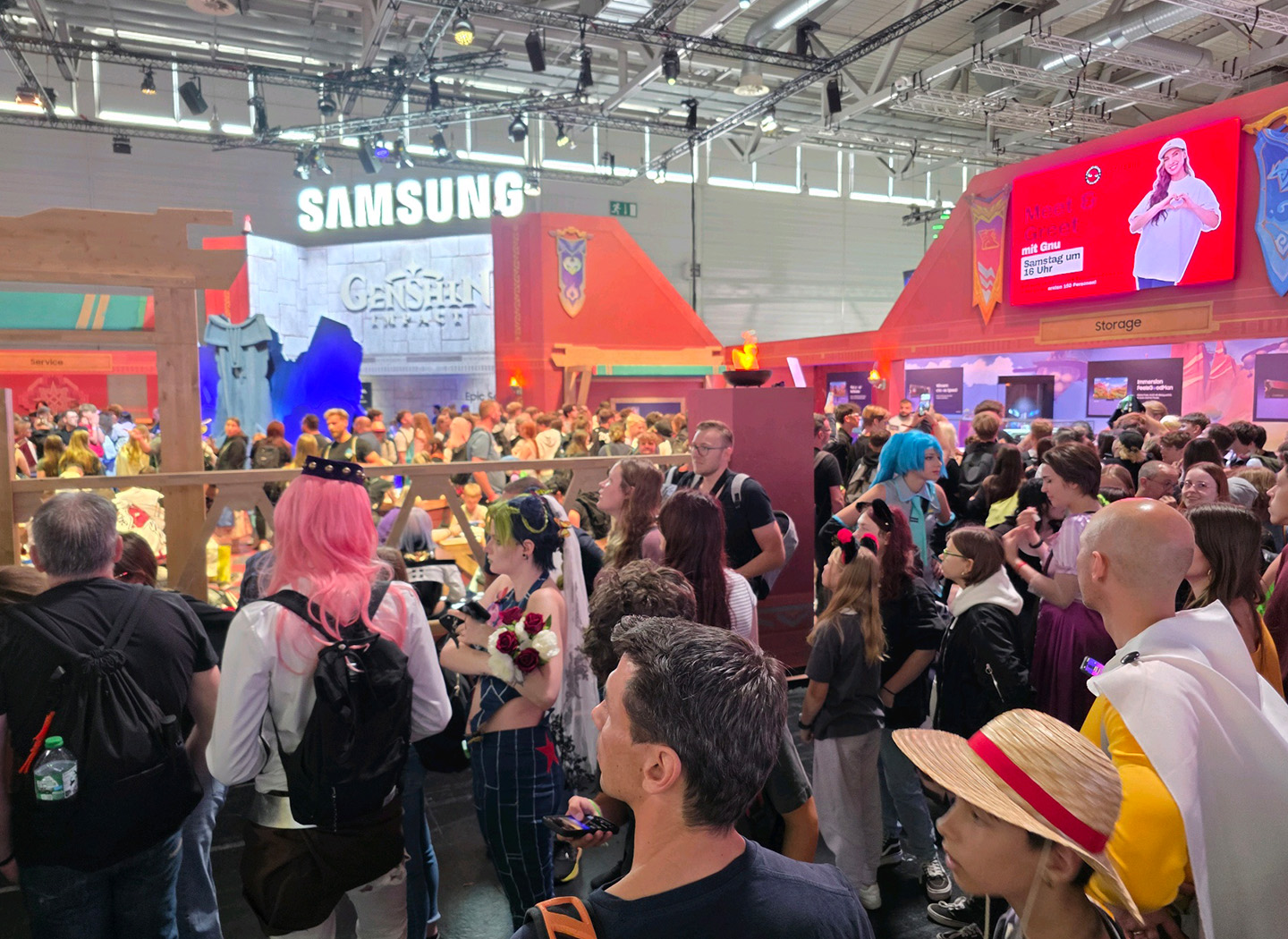 A close shot of the large crowd navigating the Samsung gameplay zones at Gamescom 2025.