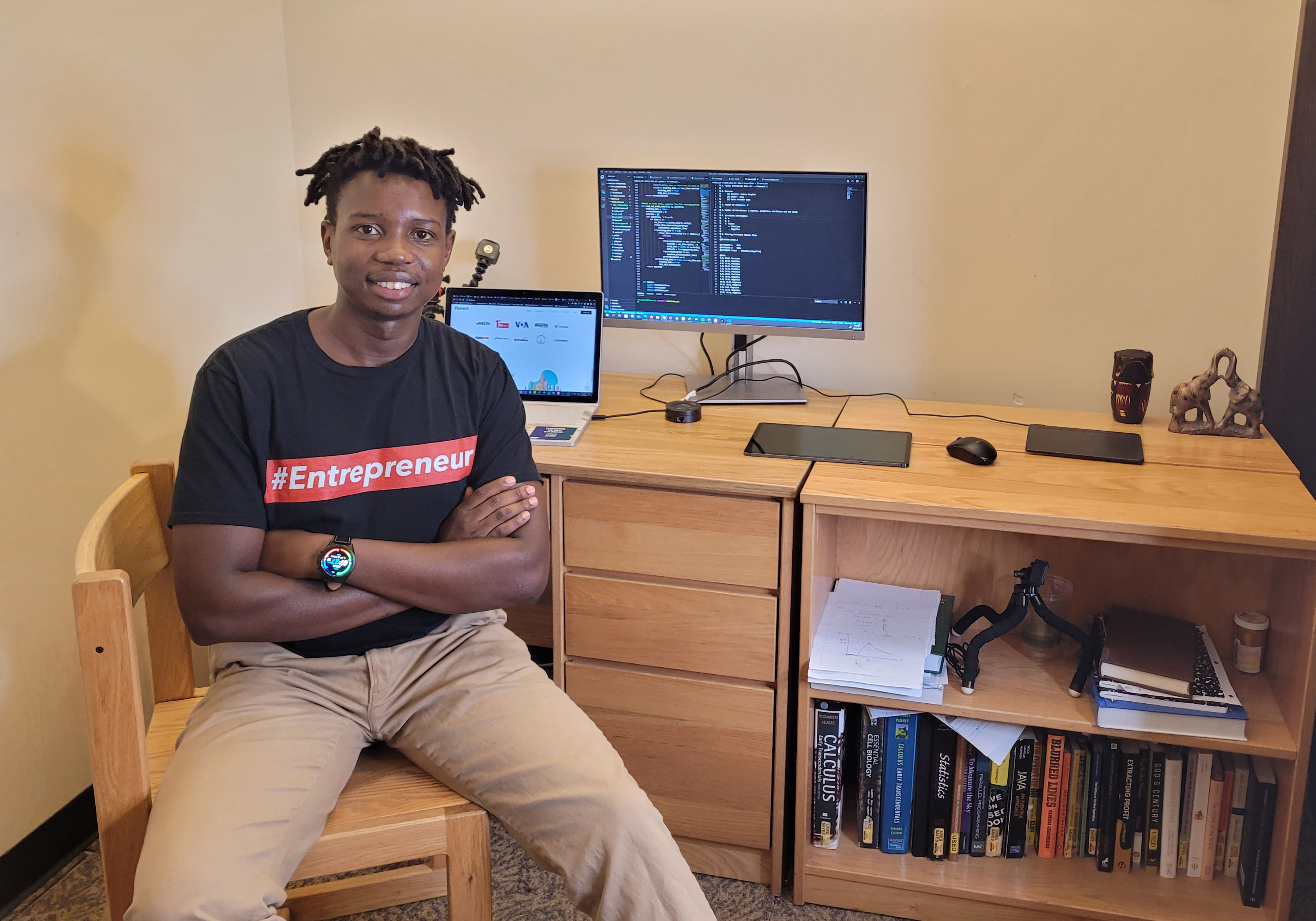 Generation17 Young Leader Tafara Makaza poses for a photo in his college dorm room